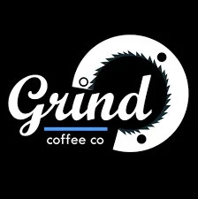 The previous Grind Coffee Co. mark: a script wordmark over a saw-blade ring